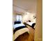 Cozy bedroom featuring two twin beds, a side table, and natural light at 7005 Stonington Ln, Charlotte, NC 28227