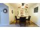 Inviting dining area featuring a ceiling fan, built-in shelving, and a round table at 7005 Stonington Ln, Charlotte, NC 28227