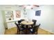 Cozy dining area with a decorative ceiling fan and elegant decor at 7005 Stonington Ln, Charlotte, NC 28227