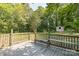 The home includes a spacious wood deck overlooking the backyard at 711 E John St, Matthews, NC 28105