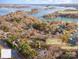 Stunning aerial view of a waterfront property with deeded boat slip and the lake beyond at 8384 Blades Trl, Denver, NC 28037