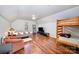 Bedroom featuring hardwood floors, natural light, comfortable seating, and bunk beds, perfect for versatile living at 8384 Blades Trl, Denver, NC 28037