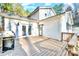 Exterior deck featuring a grill, natural wood, and ample sunlight, perfect for outdoor dining and relaxation at 8384 Blades Trl, Denver, NC 28037