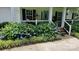 Well-maintained front yard showcasing lush hydrangea bushes and manicured landscaping, enhancing curb appeal at 8384 Blades Trl, Denver, NC 28037