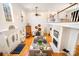 Bright living room boasts hardwood floors, fireplace, and a soaring two-story ceiling with oversized windows and balcony at 8384 Blades Trl, Denver, NC 28037