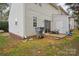 Backyard showcasing exterior of home, green grass, a patio and a fence at 9160 Exbury Ct, Charlotte, NC 28269