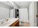 Functional bathroom featuring a vanity, toilet, and shower with a curtain at 9160 Exbury Ct, Charlotte, NC 28269