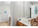 This bathroom has a wood vanity, sink, toilet, and a partial wall at 9160 Exbury Ct, Charlotte, NC 28269