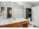 Functional bathroom features a vanity, toilet, closet, and shower with a curtain at 9160 Exbury Ct, Charlotte, NC 28269