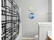 This bathroom has a toilet, shower and creative wall decorations at 9160 Exbury Ct, Charlotte, NC 28269