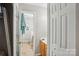 A bathroom with a wood vanity, toilet, and a closet at 9160 Exbury Ct, Charlotte, NC 28269