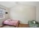 This is a bedroom with two beds and a window providing natural light at 9160 Exbury Ct, Charlotte, NC 28269