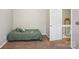 A cozy bedroom with a bed and a door that leads to the hallway at 9160 Exbury Ct, Charlotte, NC 28269