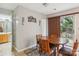 Cozy dining area featuring a wooden table and a sliding glass door to the outside at 9160 Exbury Ct, Charlotte, NC 28269