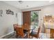 Cozy dining area featuring a wooden table and a sliding glass door to the outside at 9160 Exbury Ct, Charlotte, NC 28269