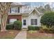 Charming two-story townhome featuring brick accents, vinyl siding, and mature landscaping at 9160 Exbury Ct, Charlotte, NC 28269