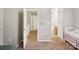 The hallway has neutral walls, and doors that lead to other rooms at 9160 Exbury Ct, Charlotte, NC 28269