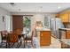 Charming kitchen featuring stainless appliances, granite countertops, and a cozy dining area with sliding glass doors at 9160 Exbury Ct, Charlotte, NC 28269