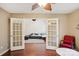 Inviting living room showcasing beautiful hardwood floors and decorative glass paneled doors at 9160 Exbury Ct, Charlotte, NC 28269