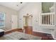 Bright living room with high ceilings, wood floors, and abundant natural light at 9160 Exbury Ct, Charlotte, NC 28269