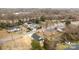 An aerial view of a home in its neighborhood, showcasing the roof, yard, and driveway at 923 Cedar St, Salisbury, NC 28144