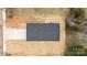 Aerial view of home showcasing a dark roof, freshly laid straw, and a concrete driveway at 923 Cedar St, Salisbury, NC 28144