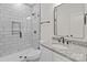 Modern bathroom featuring subway tiled shower and granite vanity at 923 Cedar St, Salisbury, NC 28144