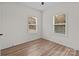 Bedroom with wood-look floors, neutral walls, and natural light at 923 Cedar St, Salisbury, NC 28144