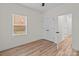 Bedroom features wood flooring, double closets, and a large window at 923 Cedar St, Salisbury, NC 28144
