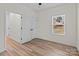 Bedroom with closet, natural light and wood-look floors at 923 Cedar St, Salisbury, NC 28144