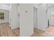 Hallway showcases wood-look flooring with doors leading to various rooms at 923 Cedar St, Salisbury, NC 28144