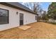 A rear exterior view showing the side door, siding, and an air conditioning unit at 923 Cedar St, Salisbury, NC 28144