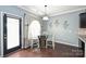 Cozy dining area featuring a round glass table set and elegant window treatments at 1035 Ivey Ct, Fort Mill, SC 29707