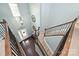 Grand two-story foyer featuring hardwood floors, chandelier, and staircase with iron railings at 1035 Ivey Ct, Fort Mill, SC 29707