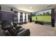 Inviting home theater with plush seating, a large screen, and surround sound, perfect for entertainment and relaxation at 1035 Ivey Ct, Fort Mill, SC 29707