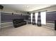 Inviting home theater with plush seating, windows, and surround sound, perfect for entertainment and relaxation at 1035 Ivey Ct, Fort Mill, SC 29707