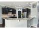 Stylish kitchen featuring dark cabinetry, granite counters and stainless steel appliances at 1035 Ivey Ct, Fort Mill, SC 29707