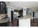 Modern kitchen with granite countertops, stainless steel appliances and dark cabinetry at 1035 Ivey Ct, Fort Mill, SC 29707