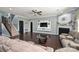 Spacious living room with fireplace, large screen tv, and staircase access at 1035 Ivey Ct, Fort Mill, SC 29707