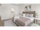 Serene main bedroom featuring a plush bed, stylish decor, and a glimpse of the en-suite bathroom, creating a relaxing retreat at 108 Sari St, Troutman, NC 28166