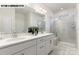 Bright bathroom with double vanity sinks, glass shower, and modern finishes at 110 Noah Ln, Troutman, NC 28166