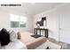 Well-lit bedroom showcasing neutral tones and a large window at 110 Noah Ln, Troutman, NC 28166