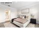 Bright bedroom boasts a neutral color scheme and stylish decor at 110 Noah Ln, Troutman, NC 28166