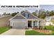 Charming single-Gathering home with inviting front porch, neutral siding, and manicured lawn at 110 Noah Ln, Troutman, NC 28166