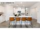 Bright kitchen featuring an island with bar stool seating, modern cabinetry, and pendant lights at 110 Noah Ln, Troutman, NC 28166