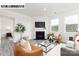 Inviting living room with a fireplace, comfortable seating, and an open view to the Primary bedroom at 110 Noah Ln, Troutman, NC 28166