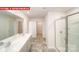 Well-lit bathroom features double sinks and walk-in shower at 11123 Cardinal Creek Ave, Charlotte, NC 28215