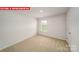 A cozy bedroom featuring plush carpet, white walls, and a window at 11123 Cardinal Creek Ave, Charlotte, NC 28215