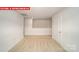 Open bonus room featuring neutral carpet and white walls at 11123 Cardinal Creek Ave, Charlotte, NC 28215
