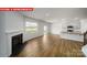 Spacious living area with fireplace and adjacent kitchen space at 11123 Cardinal Creek Ave, Charlotte, NC 28215